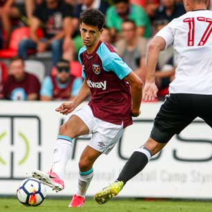 Nathan Holland in action against Fulham