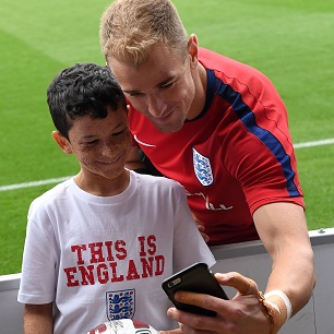 Joe Hart meets a young England fan at St George's Park