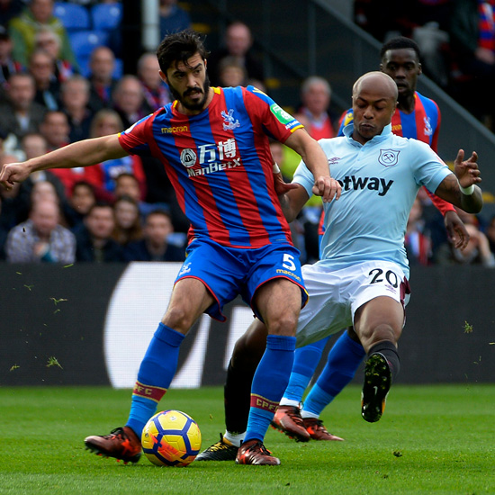 Andre Ayew challenges James Tomkins