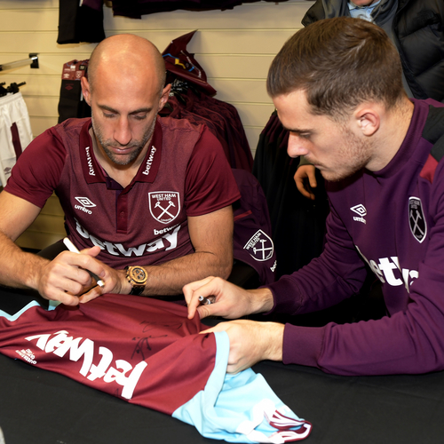 Zaba and Martinez at Basildon store, signing a West Ham shirt