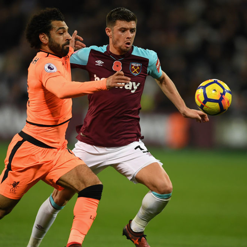 Aaron Cresswell battles with Salah