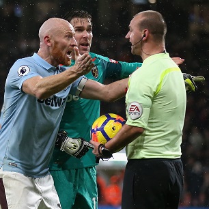 Captain James Collins remonstrates with referee Bobby Madley