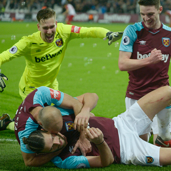 The Hammers celebrate Andy Carroll's winner