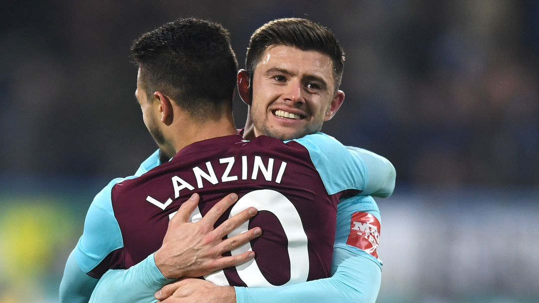 Aaron Cresswell hugs Manuel Lanzini