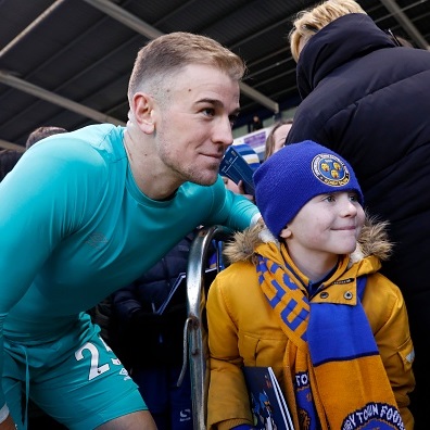 Joe Hart poses for a photo with a young Shrewsbury Town supporter