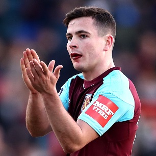 Josh Cullen applauds the supporters at Shrewsbury Town