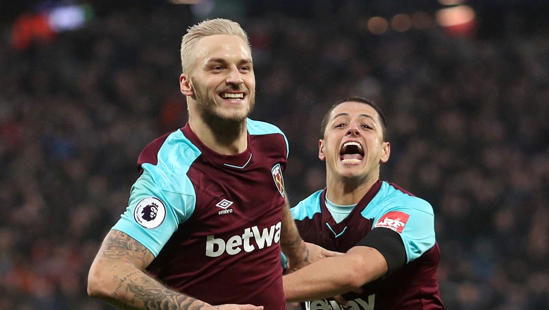 Marko Arnautovic and Chicharito celebrate the Austrian's goal