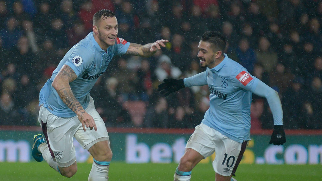 Manuel Lanzini celebrates with Marko Arnautovic