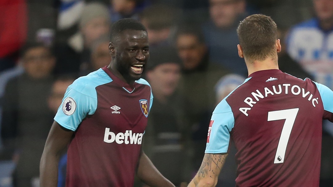 Cheikhou Kouyate celebrates with Marko Arnautovic