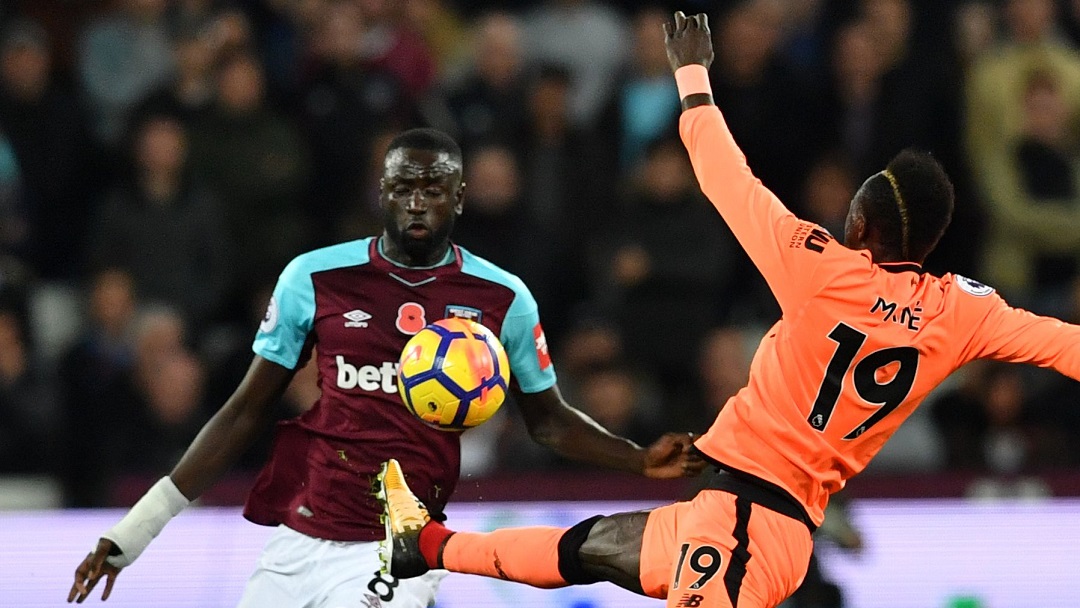 Cheikhou Kouyate and Sadio Mane battle for possession