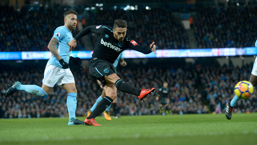 Manuel Lanzini in action against Argentina teammate Nicolas Otamendi