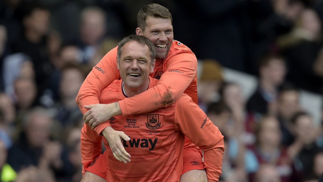 Ludek Miklosko carries Jimmy Walker during Mark Noble's Testimonial in 2016