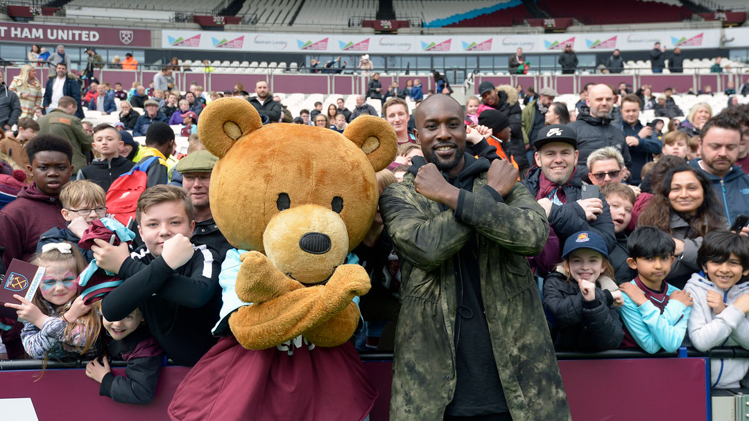 Bubbles the Bear and Carlton Cole meet youngsters at the Family Fun Day
