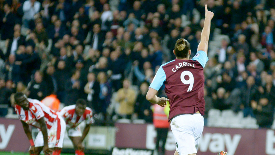 Carroll celebrates his goal against Stoke