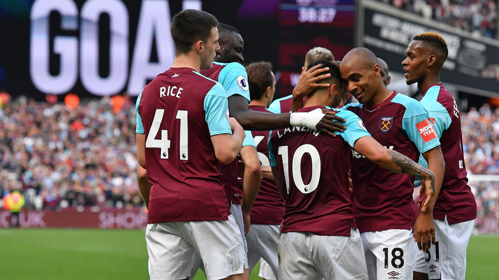 West Ham players celebrate a goal against Everton