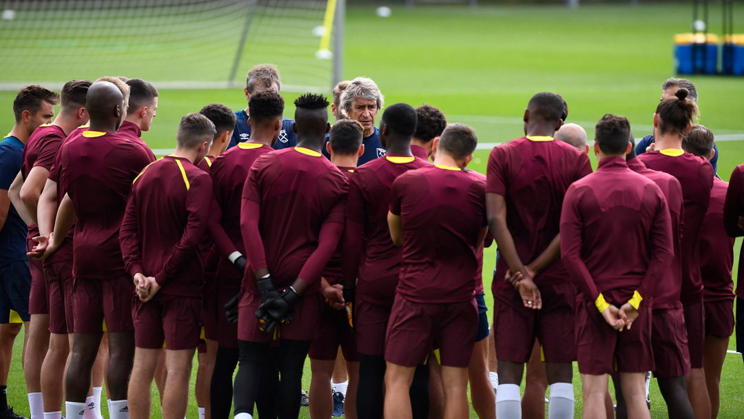 Manuel Pellegrini talks to his players in Switzerland