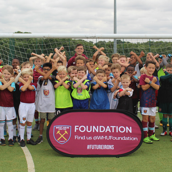 Josh Cullen with youngsters at a Foundation Soccer School