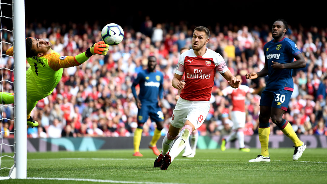 Lukasz Fabianski makes a save at Arsenal