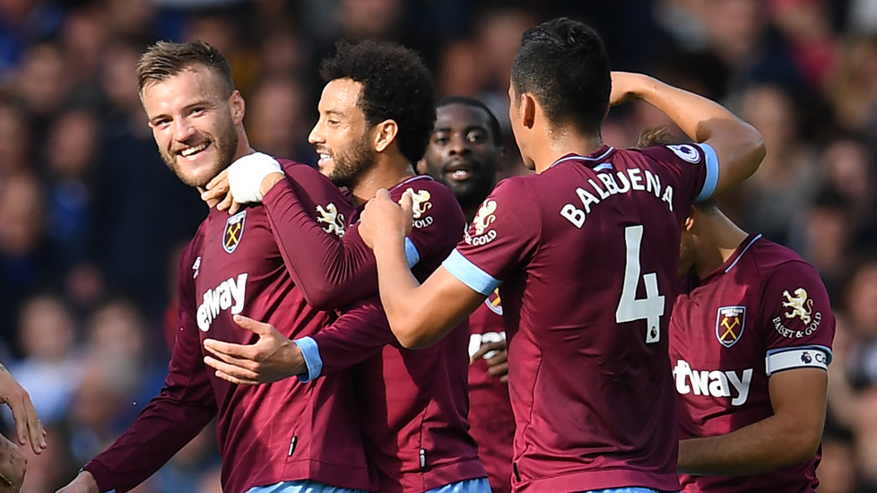 The Hammers players celebrate at Everton