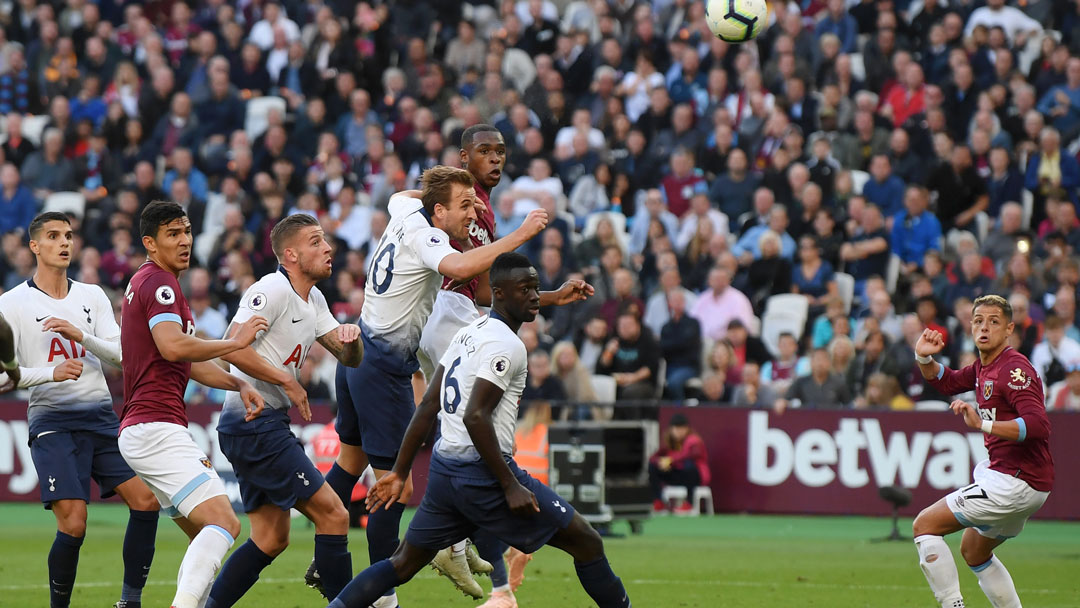 Issa Diop blocks a shot from Harry Kane