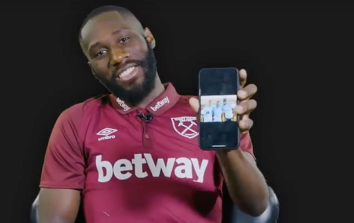 Arthur Masuaku shows his phone to the camera