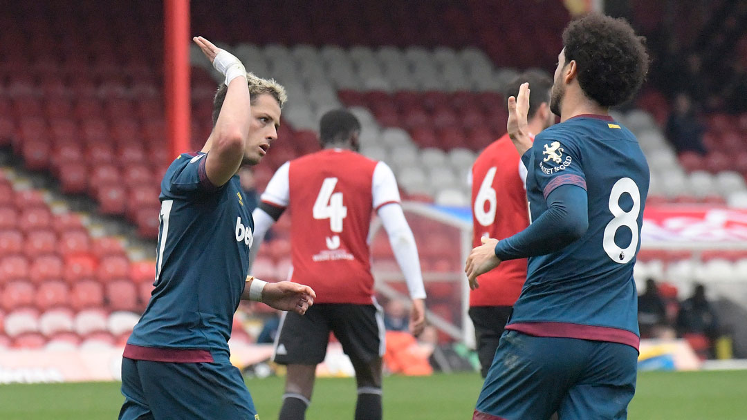 Chicharito celebrates his goal with Felipe Anderson