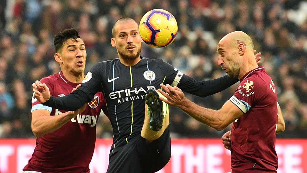 Fabian Balbuena and Pablo Zabalata challenge David Silva