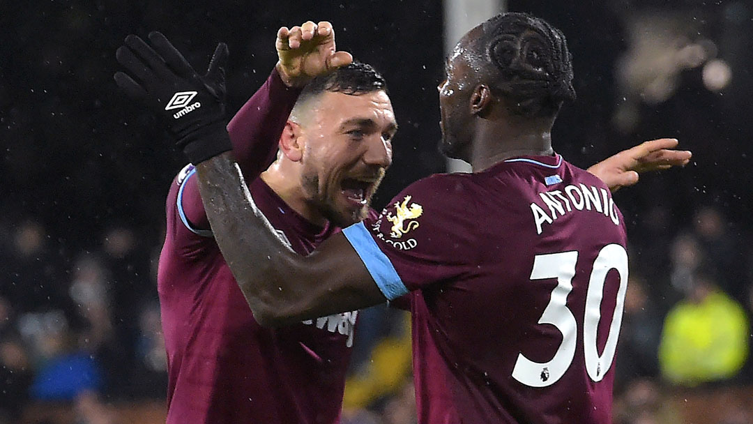 Robert Snodgrass and Michail Antonio celebrate at Craven Cottage