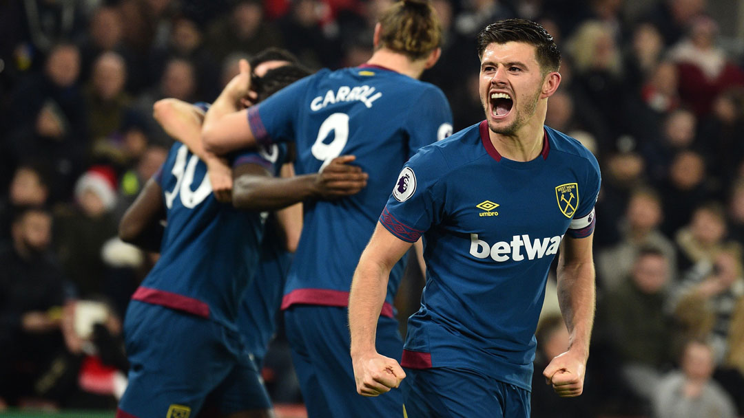 Captain Aaron Cresswell celebrates at St Mary's Stadium