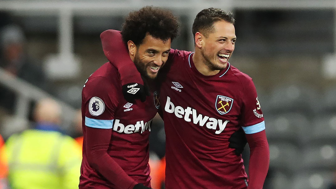 Felipe Anderson and Chicharito celebrate at Newcastle United