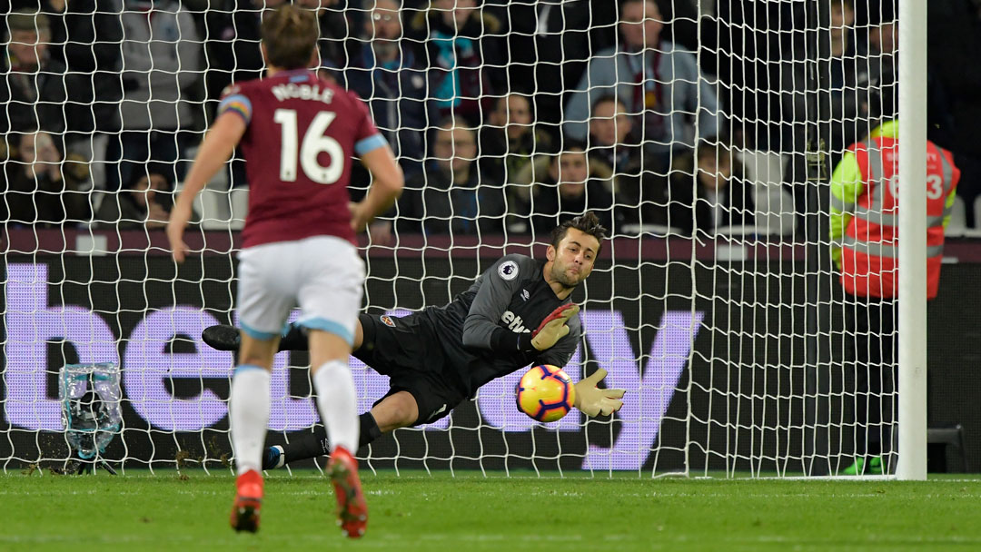 Lukasz Fabianski saves a penalty taken by Cardiff's Joe Ralls