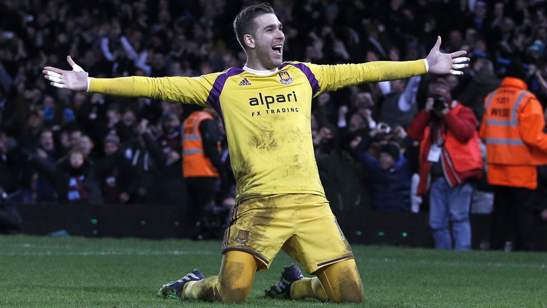 Adrian slides on his knees after converting the winning penalty