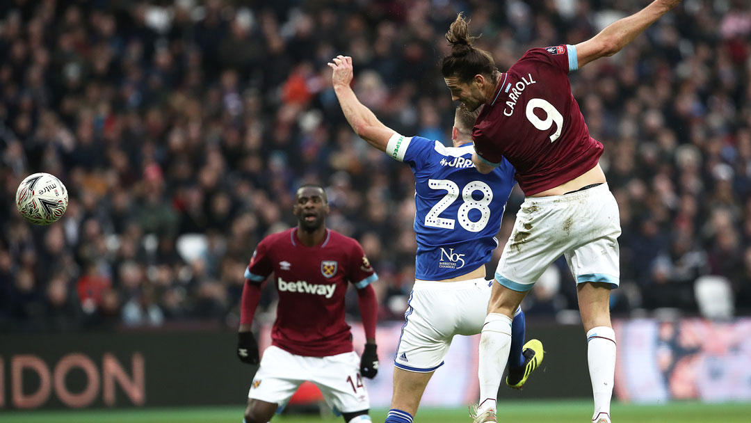Andy Carroll scores with a trademark header against Birmingham City
