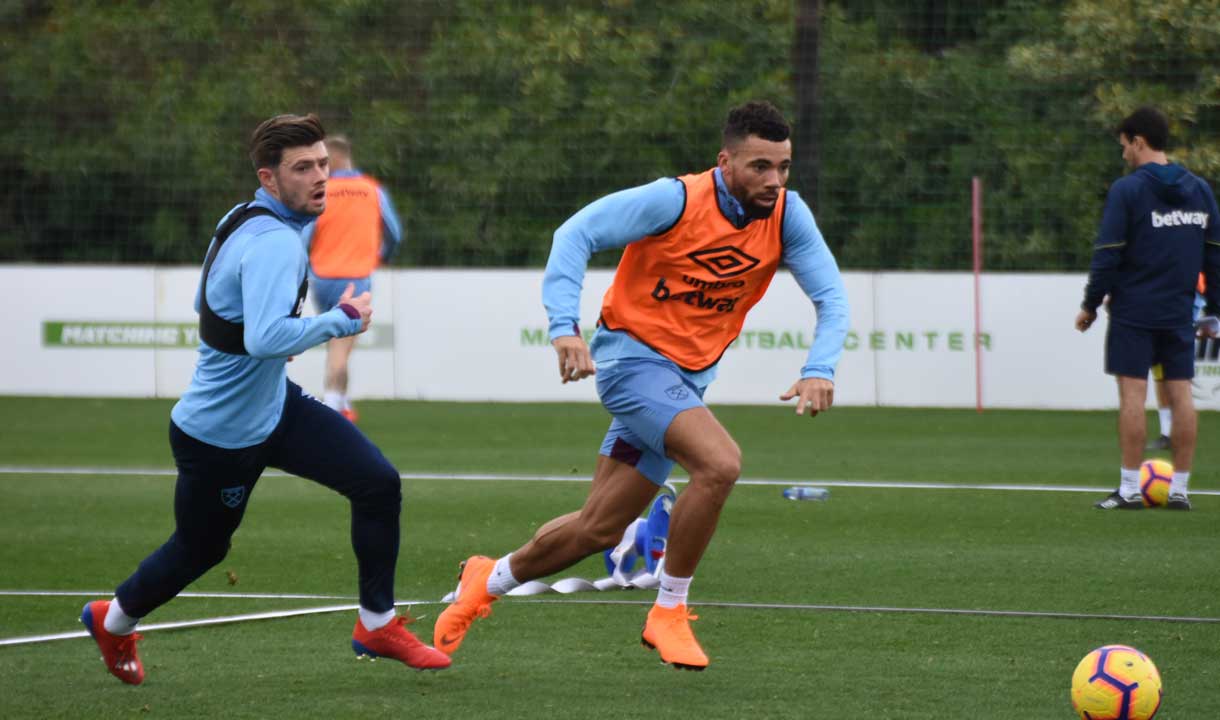 Aaron Cresswell chases Ryan Fredericks