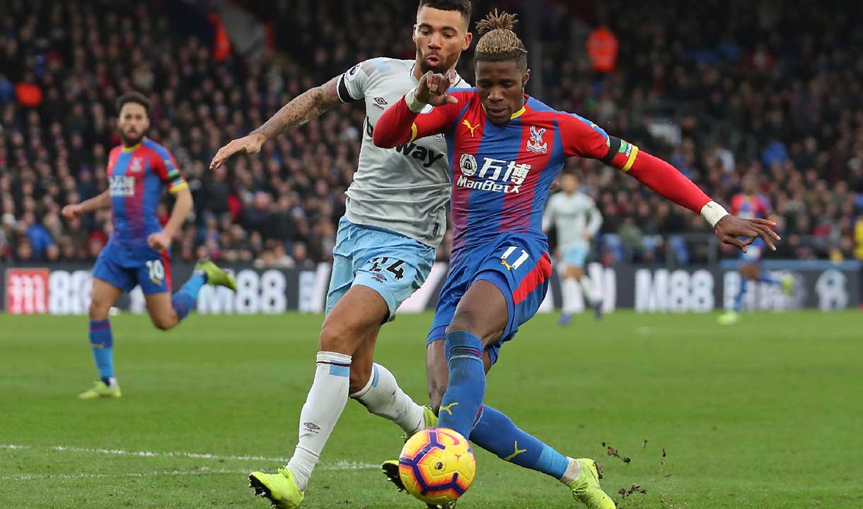 Ryan Fredericks shepherds Wilfried Zaha