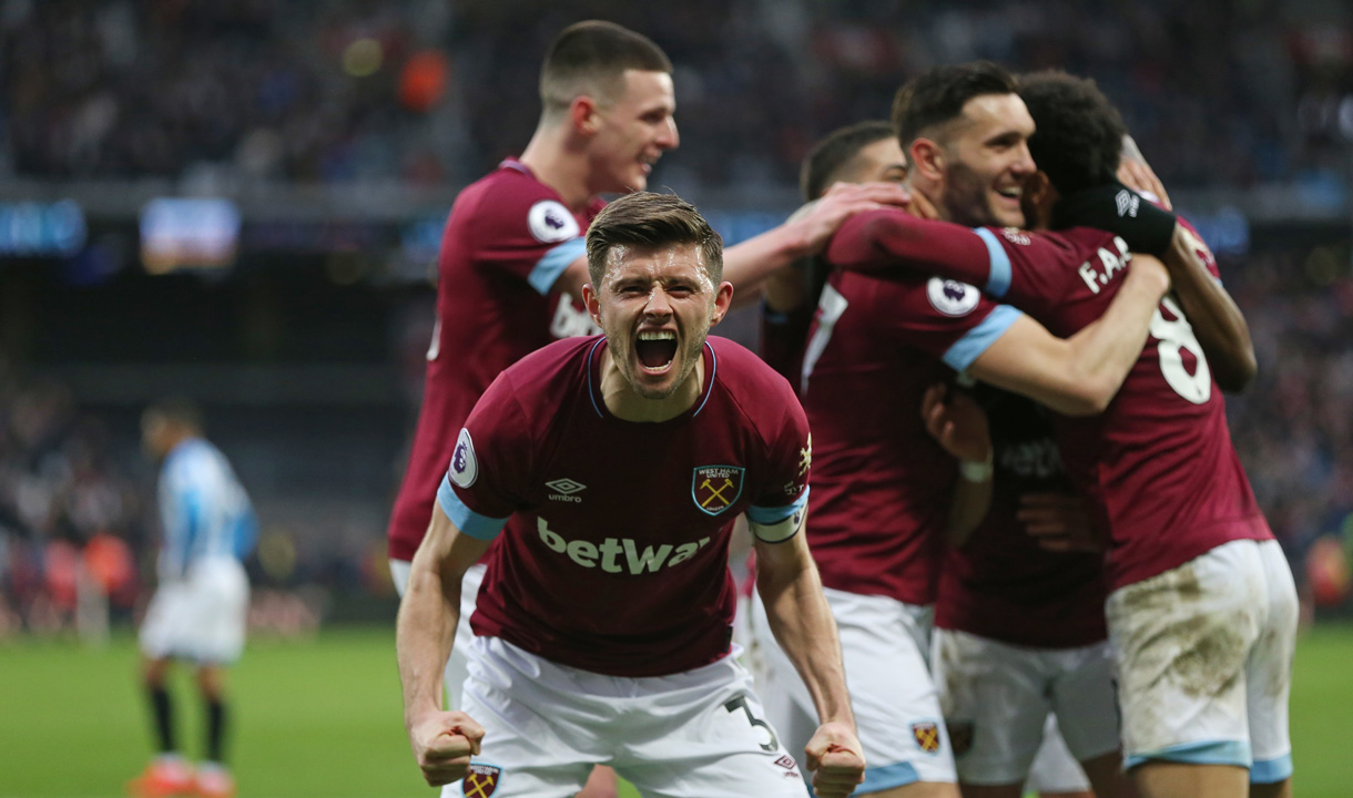 The Hammers celebrate their winner against Huddersfield