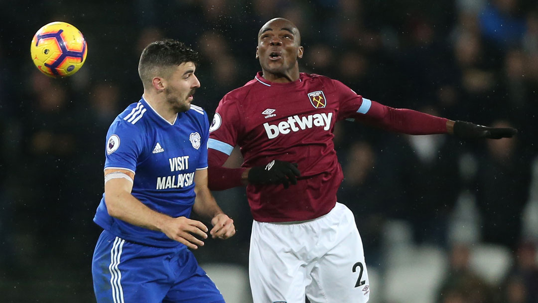 Callum Paterson challenges Angelo Ogbonna for a high ball