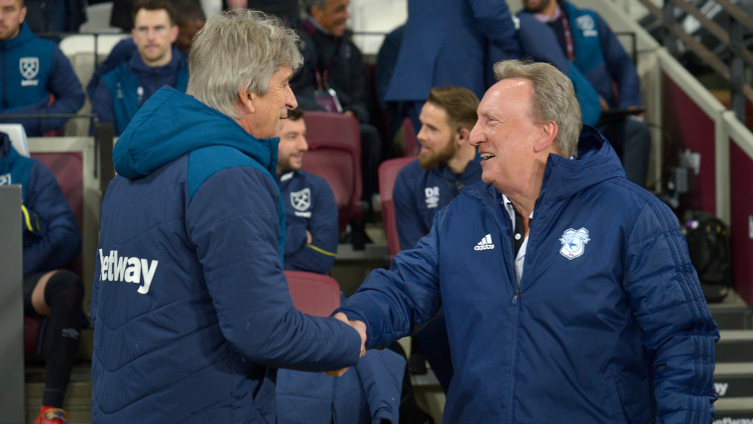 Manuel Pellegrini greets Cardiff City manager Neil Warnock at London Stadium in December