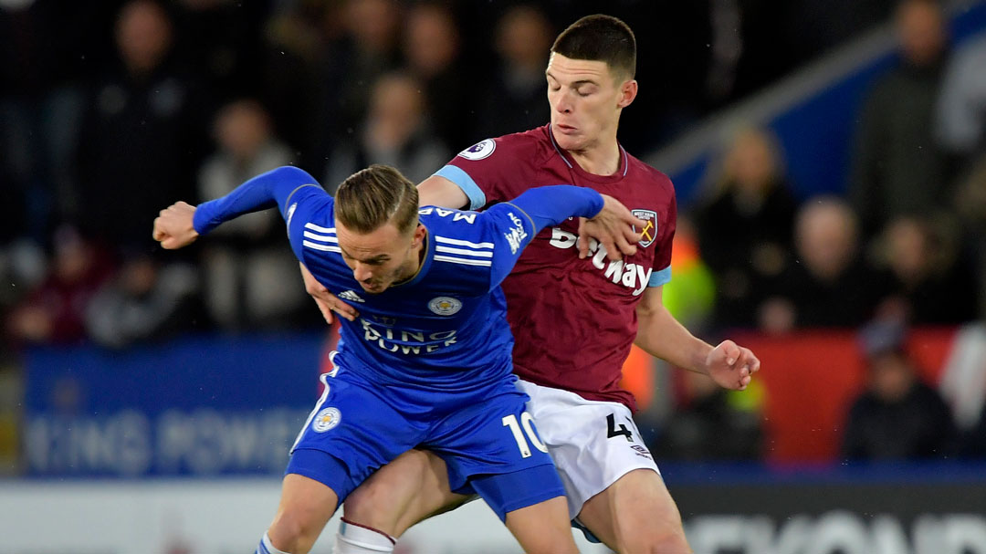Declan Rice battles for possession with Leicester City's James Maddison