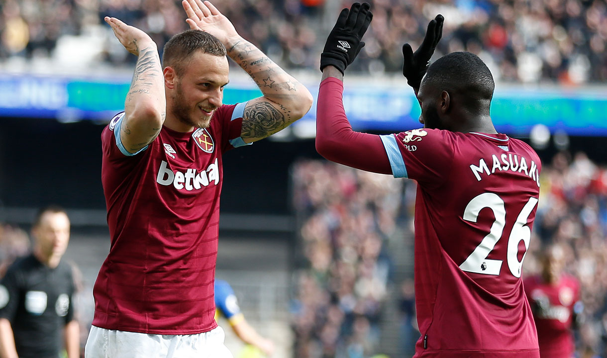 Marko Arnautovic celebrates with Arthur Masuaku