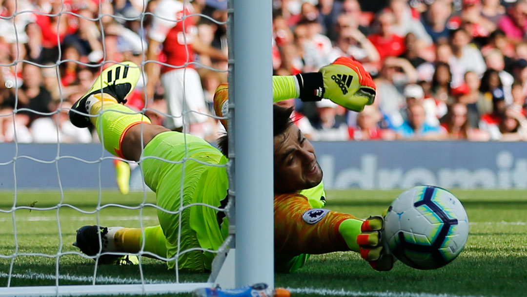 Lukasz Fabianski makes a save at Arsenal