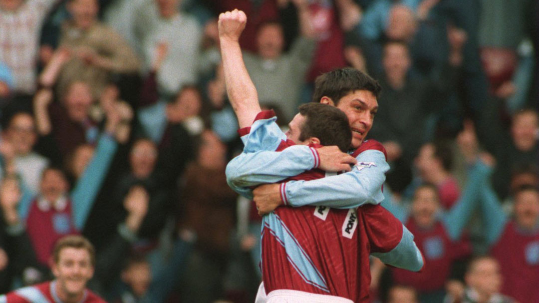 Michael Hughes celebrates scoring against Manchester United in May 1995