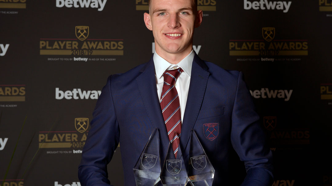 Declan Rice with his three awards trophies