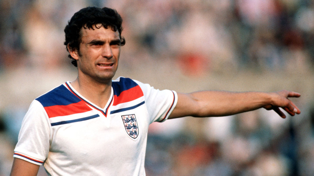 Trevor Brooking in action for England