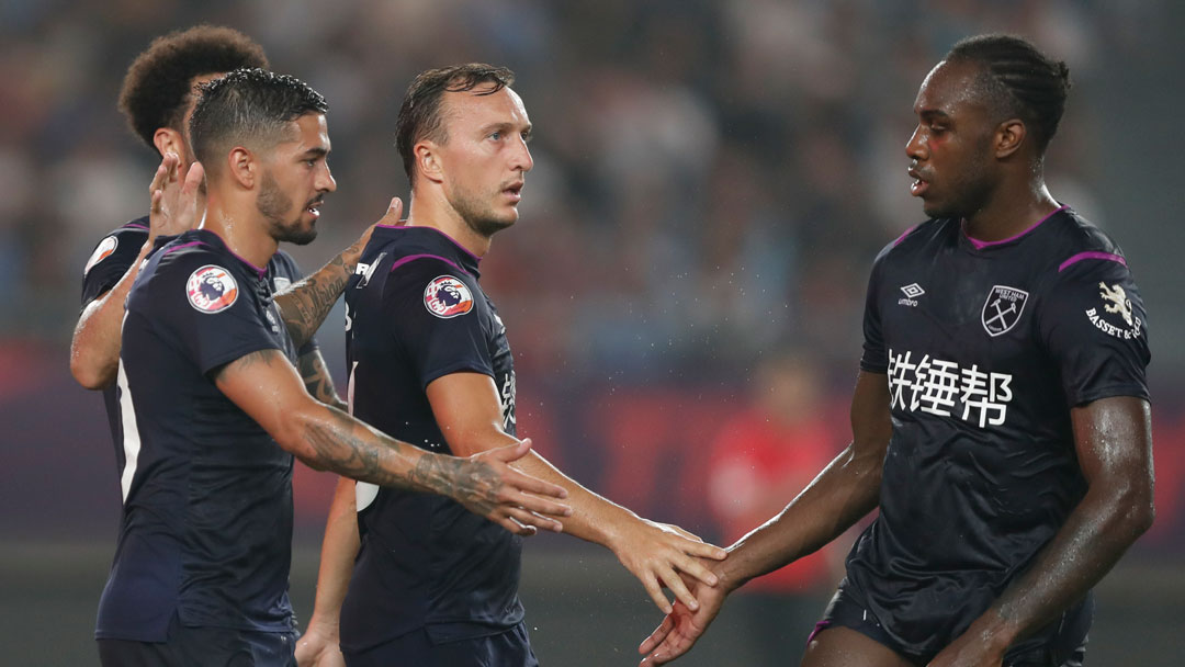 Mark Noble celebrates scoring in Nanjing