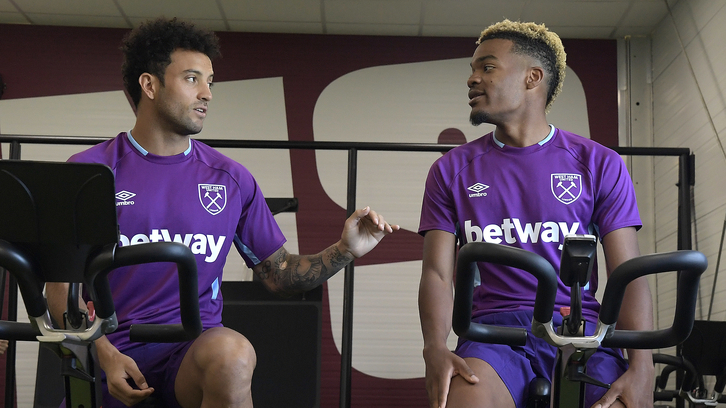 Felipe Anderson chats with Grady Diangana on the first day of pre-season at Rush Green Stadium