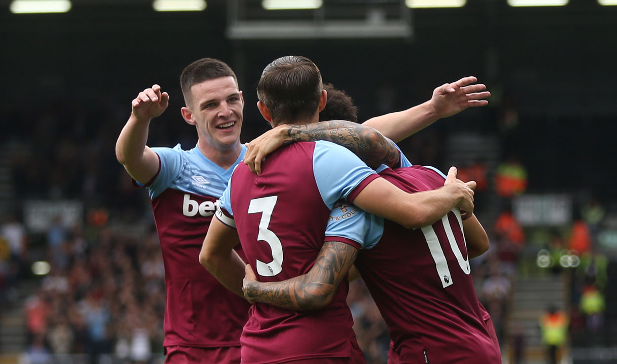 West Ham's players celebrate scoring at Fulham