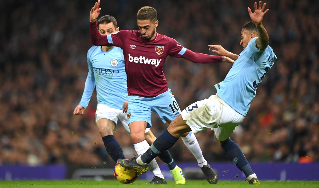 Manuel Lanzini in action against Manchester City