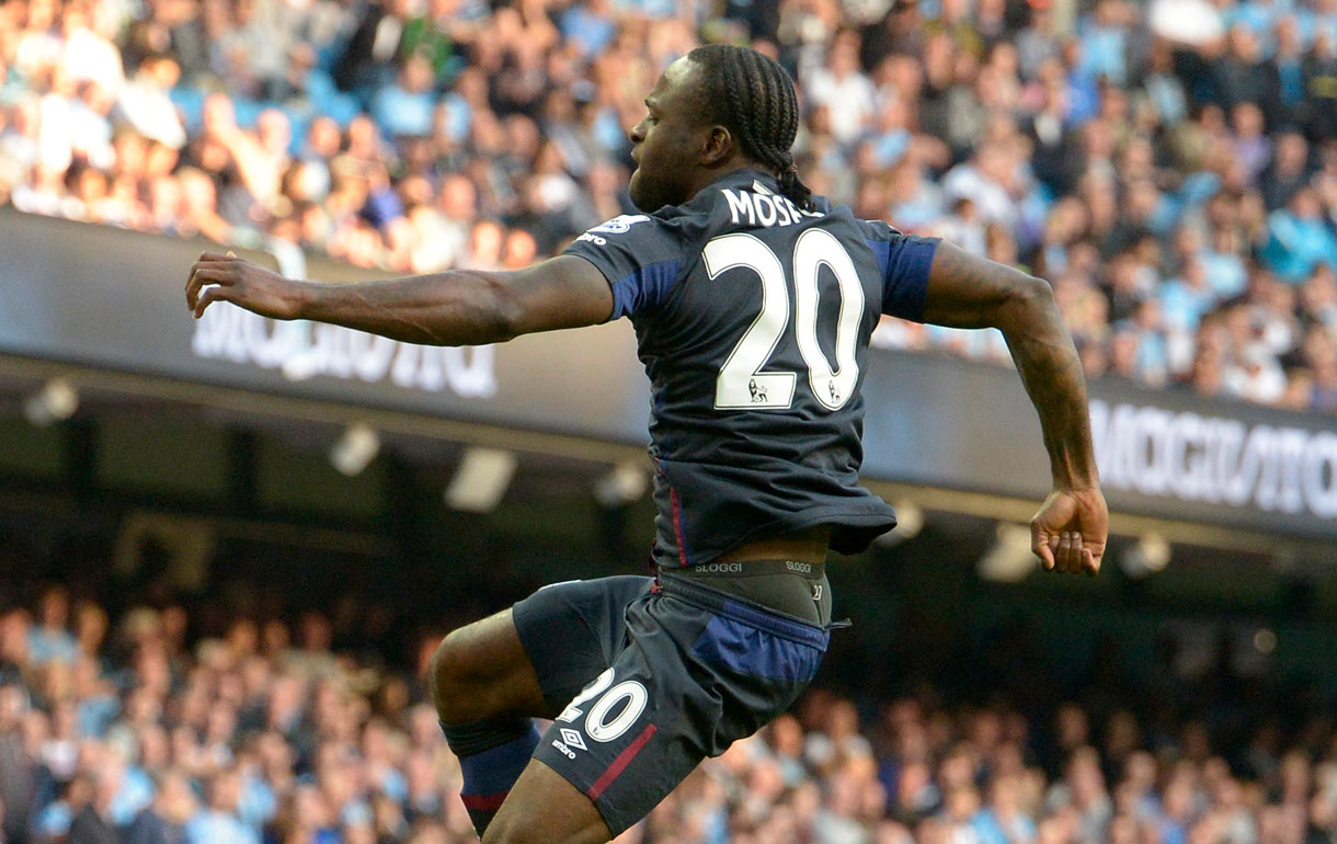 Victory Moses celebrates scoring at Manchester City