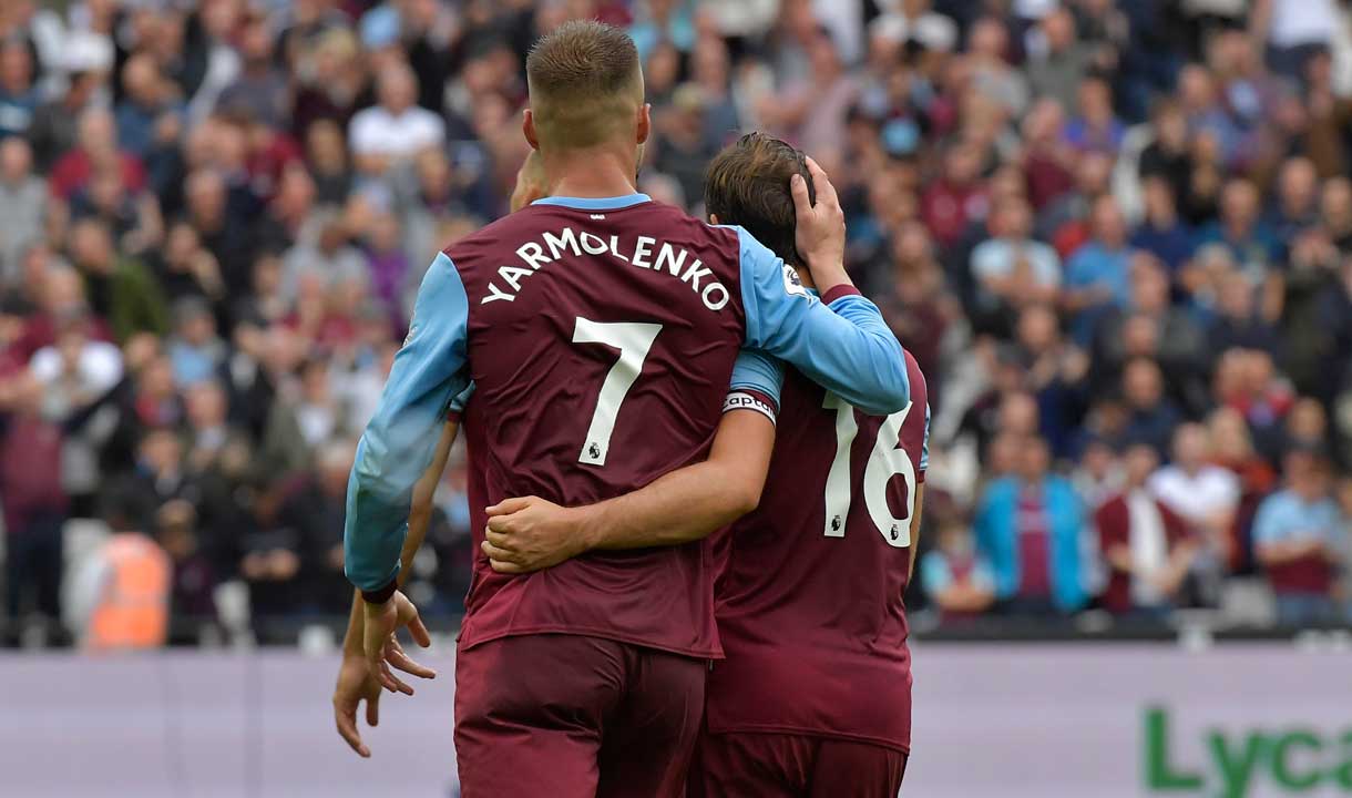 Andriy Yarmolenko celebrates with Mark Noble